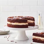 fixing ganache on tuxedo cake