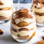 Garnished tiramisu cups served in glassware