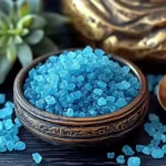 Bowl of vibrant blue salt crystals used in the viral Blue Salt Trick Recipe