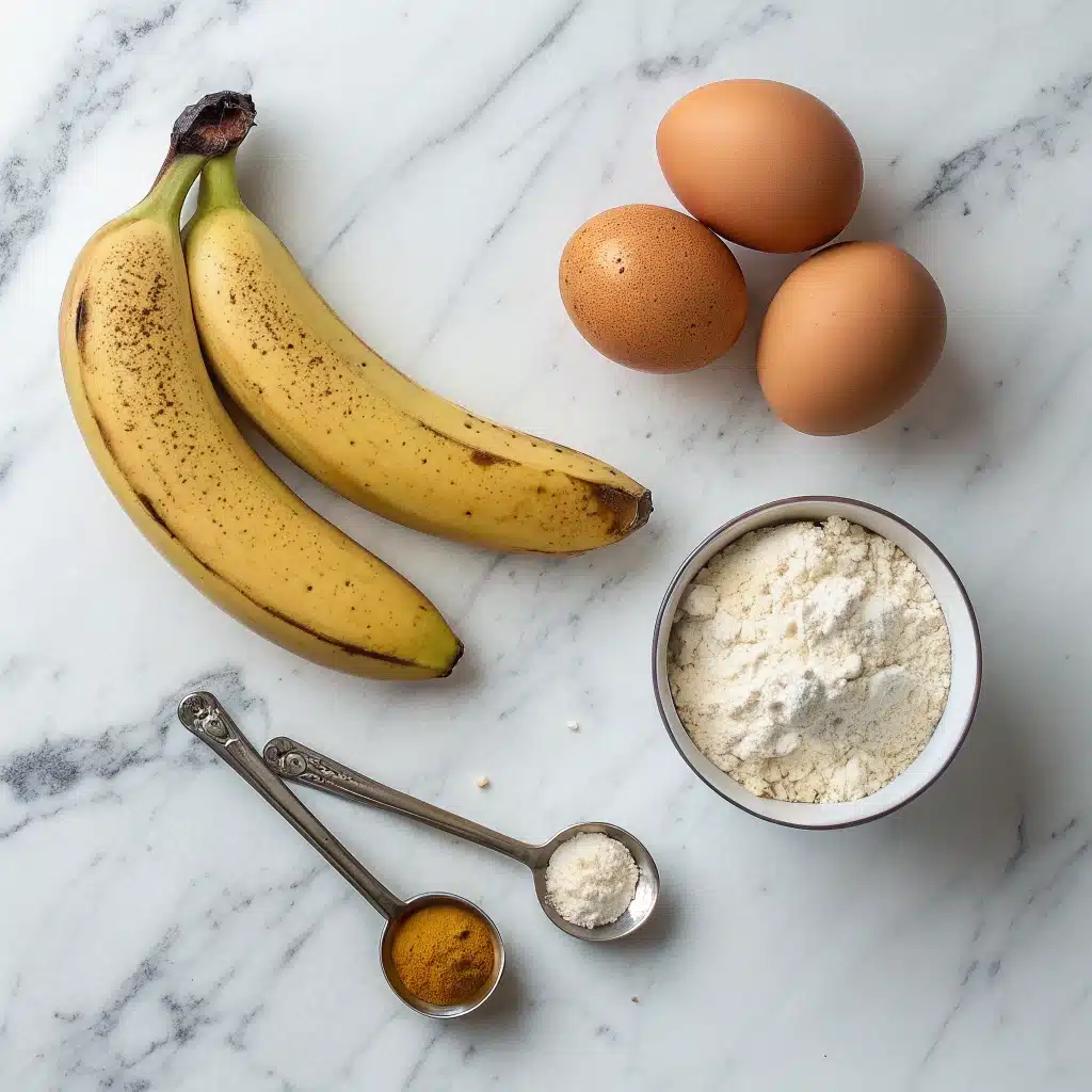 Three ripe bananas, two eggs, and a scoop of vanilla protein powder arranged on a clean surface, ready for making protein banana bread.