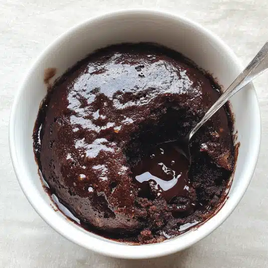 Rich and gooey chocolate pudding cake with a soft, fudgy sauce layer