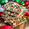 Christmas Crack made with saltine crackers, buttery toffee, melted chocolate, and festive holiday toppings