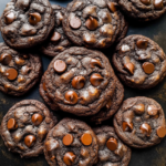 Freshly baked double chocolate chip cookies with rich cocoa dough and melted chocolate chips